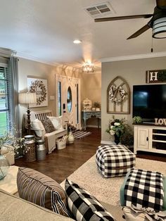 a living room filled with furniture and a flat screen tv