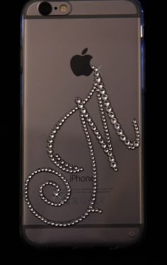 an iphone case with the number six on it's back and some diamonds in front