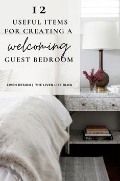 a bed with white sheets and pillows next to a lamp on top of a table