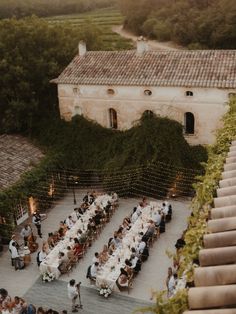 an aerial view of people sitting at tables outside