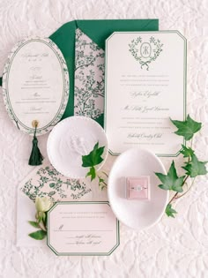 the wedding stationery was done in green and white