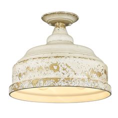 an old light fixture is shown against a white background and has peeling paint on it