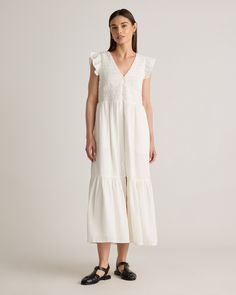 Our Organic Textured Cotton Smocked V-neck Midi Dress is crafted from luxurious organic cotton, featuring a subtle texture that adds depth and interest to its classic silhouette. With a flattering v-neckline and ruffle cap sleeves, this dress is designed for a relaxed fit that drapes beautifully, allowing for ease of movement and all-day comfort. Surf Dress, 2024 Family, Draped Skirt, Silk Cami, Family Pics, V Neck Midi Dress, Quarter Zip Sweater, Women's Wardrobe, Blouse Dress