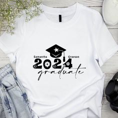 a white t - shirt with the words graduation and a graduate's cap on it