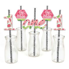 four watermelon themed straws in vases