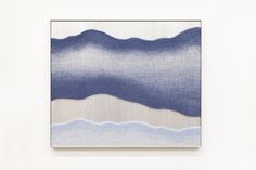 an abstract painting in blue and white with wavy lines on the bottom half of it