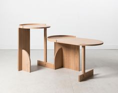 two wooden tables sitting next to each other