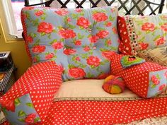 a couch covered in lots of colorful pillows