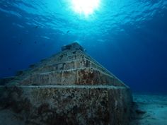 an underwater view of a pyramid in the ocean