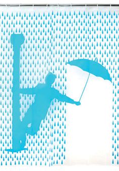 a man holding an umbrella standing in front of a blue and white background with water drops