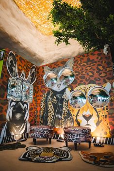 an animal themed living room with leopard and giraffe wallpaper on the walls