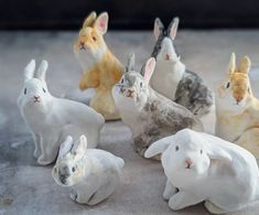 a group of small ceramic rabbits sitting next to each other