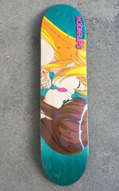 a skateboard that is laying on the ground with it's bottom half up