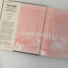 the inside pages of a pink book with an image of flowers and vases on it