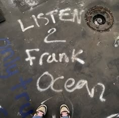 someone's feet standing in front of a drain with the words listen and frank ocean written on it