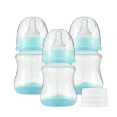 three baby bottles sitting next to each other