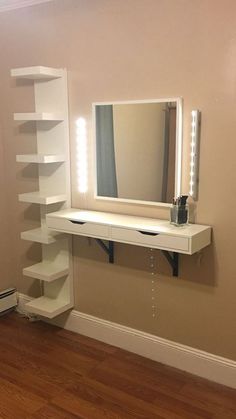 a white shelf with a mirror and lights on it