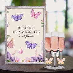 there are two wine glasses next to a card that says because he makes her heart flutterer