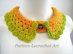 a crocheted necklace with an orange, green and yellow flower on the front