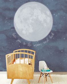 a child's room with a full moon painted on the wall and a chair