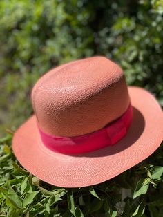 "Optimo style hat. A classic style also know as \"colonial\" This comes in a beautiful salmon color and pink grosgrain ribbon.  Our family has been in Ecuador since the 1600's. We are part of the culture, the land and are still in awe of its beauty. We work with artisan families that have been weaving paja toquilla hats for generations. This community of artisans are mostly settled in the small town of Chordeleg and SigSig nestled in the Andes Mountains of Ecuador. The sense of community is evid Andes Mountains, Salmon Color, The Culture, Phoenix Az, Small Town, The Land, Grosgrain Ribbon, Ecuador, Hat Fashion