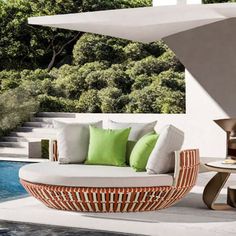 an outdoor seating area next to a swimming pool