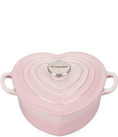 a pink heart shaped casserole dish with two handles on the top and bottom