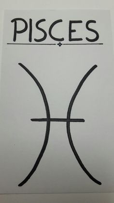 the pisces symbol is drawn on a piece of paper