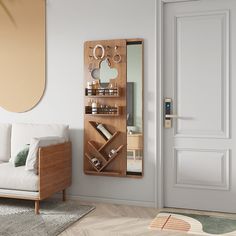 a living room with a white couch, mirror and wooden shelf on the wall next to it