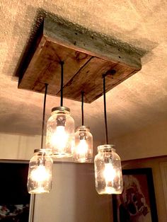 mason jar chandelier hanging from the ceiling