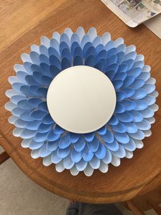 a paper plate sitting on top of a wooden table