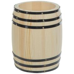 a wooden barrel sitting on top of a white table next to a black strap around it