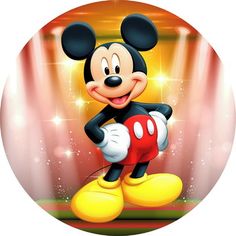 a mickey mouse standing on top of a stage with spotlights in the back ground