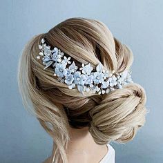 Dusty blue wedding headpiece with handmade flowers. Pale blue flowers bridal hair piece with freshwater pearls and rhinestones. Light blue flowers bridal double comb for wedding.  The length of the accessory in the photo 25 cm (9,8").  Please take a look at the matching accessories in my store: https://www.etsy.com/shop/JewelryforbridesShop?ref=seller-platform-mcnav Small handmade flowers and leaves , hand-painted with jewelry enamel, will perfectly decorate your hair. It is very flexible/bendable for easy placement and can be worn in many different ways, depending on your hairstyle.  CARE INSTRUCTIONS: Accessories are delicate, so please handle with care. Do not spray hairspray on the accessory! CUSTOM ORDERS: I'm happy to create a custom order just for you! We can modify any design - use Blue Wedding Headpiece, Flowers Bridal Hair, Pale Blue Flowers, Jewelry Enamel, Daisy Wedding, Dusty Blue Wedding, Light Blue Flowers, Bridal Hair Piece, Bridal Hair Flowers