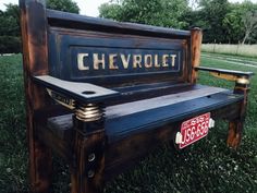 an old bench that has been turned into a park bench with the name chevrolit written on it