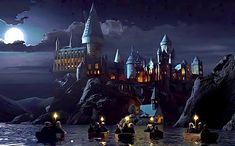 some people are floating in the water with their lights on at hogwart's castle