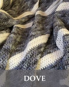 an image of a blanket with the words dove written in white and black on it