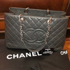 100% Authentic Chanel Quilted Dark Grey Chanel Bag With Silver Hardware Barely Used And In Great Condition - Comes With Box And Dust-Bag Height -10” Width- 16” Luxury Large-capacity Bag, Large Luxury Shopping Bag, Designer Formal Bags With Large Capacity, Designer Large Capacity Formal Bags, Large Luxury Bags With Removable Pouch, Luxury Large Shoulder Bag With Top Carry Handle, Luxury Large Shoulder Bag With Removable Pouch, Elegant Large Shoulder Bag With Top Carry Handle, Everyday Luxury Large Capacity Rectangular Shoulder Bag