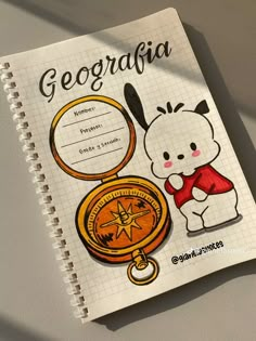 a notebook with an image of a bear holding a compass and the words geordia on it