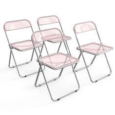 three pink folding chairs sitting next to each other