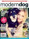 the cover of modern dog magazine with a woman and her dog on it's back