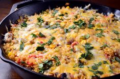 a casserole dish with cheese, meat and vegetables