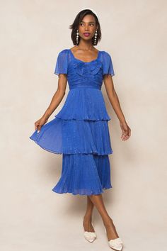 The Cecily Dress is a whimsical addition to any wardrobe. Made from blue chiffon with metallic thread, this midi-length dress features a sweetheart neckline, flutter sleeves, and a tiered skirt for a charming touch. Pleated detailing and a bow on the bodice add extra flair, while the hidden back zipper ensures a perfect fit. With a lined bodice and skirt, this women's dress is both stylish and comfortable. Ivy City Women's Cecily Dress | Size: 24W Thanksgiving Dress, Girls Holiday Dresses, City Woman, White Dress Party, Holiday Party Dresses, Formal Dresses For Women, Mom Dress, Dress 16, Everyday Dresses