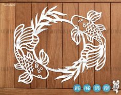 a paper cut out of a fish on a wooden background