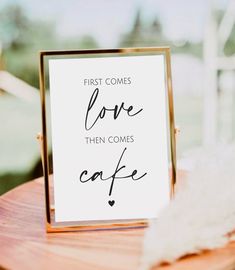 a sign that reads, first comes love then comes coffee on top of a wooden table