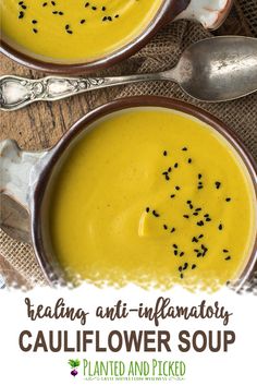 two bowls of cauliflower soup with spoons on the side and text overlay reading healthy anti - inflamatory cauliflower soup