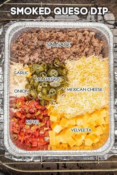 a tray with different types of food on it and labeled in the words smoked queso dip