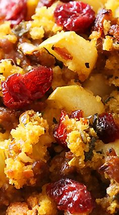 a close up of a plate of food with cranberries and other toppings