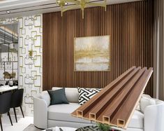 a living room filled with furniture next to a dining room table and chairs on top of a hard wood floor