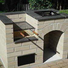 an outdoor brick oven is shown with the door open and grill on it's side